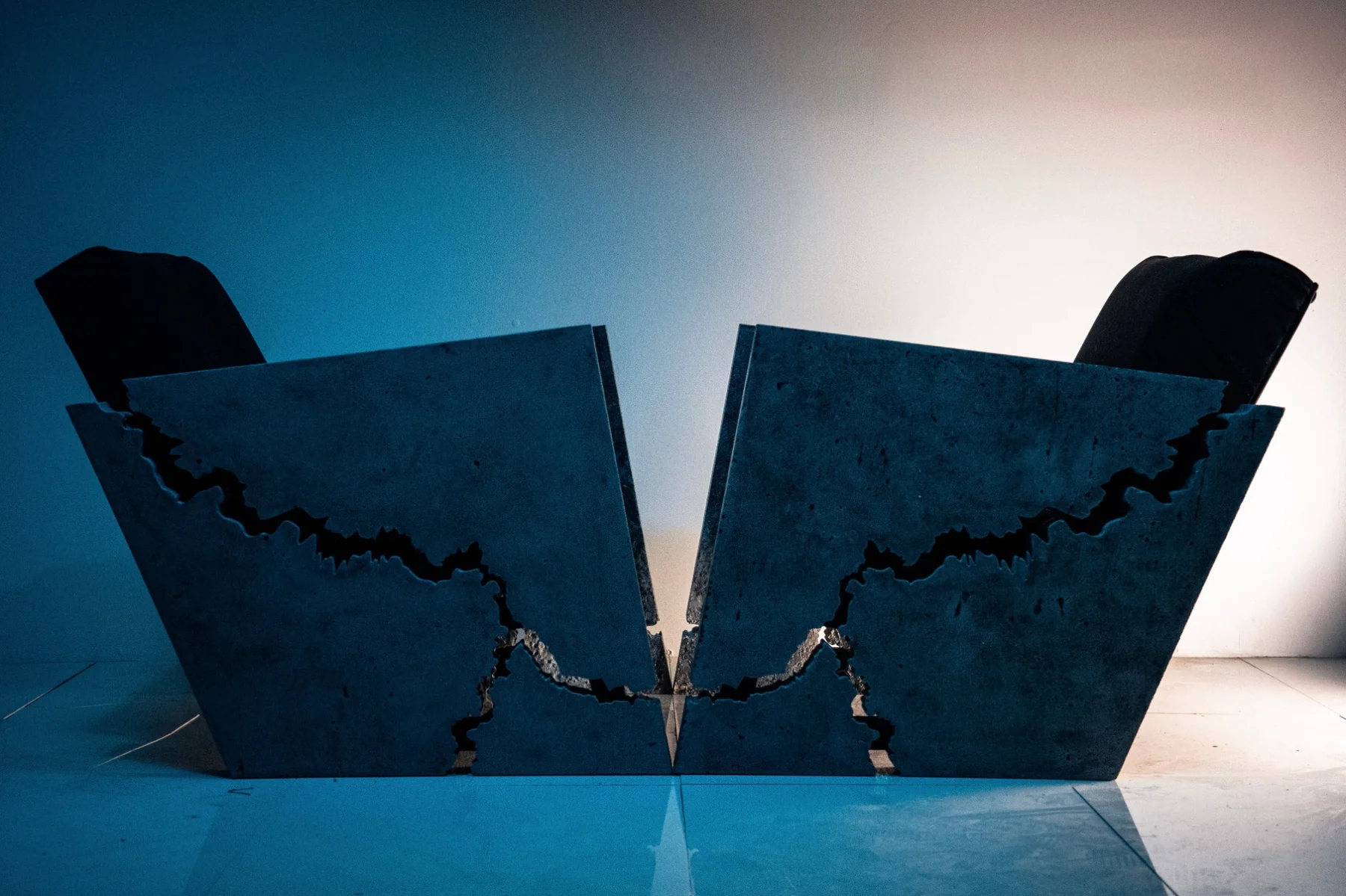 Pair of sculptural fractured concrete chairs